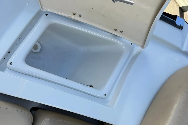 Slide: The Image of 2018 Crownline Eclipse E24 XS boat interior with beige seating and sleek design. - 18