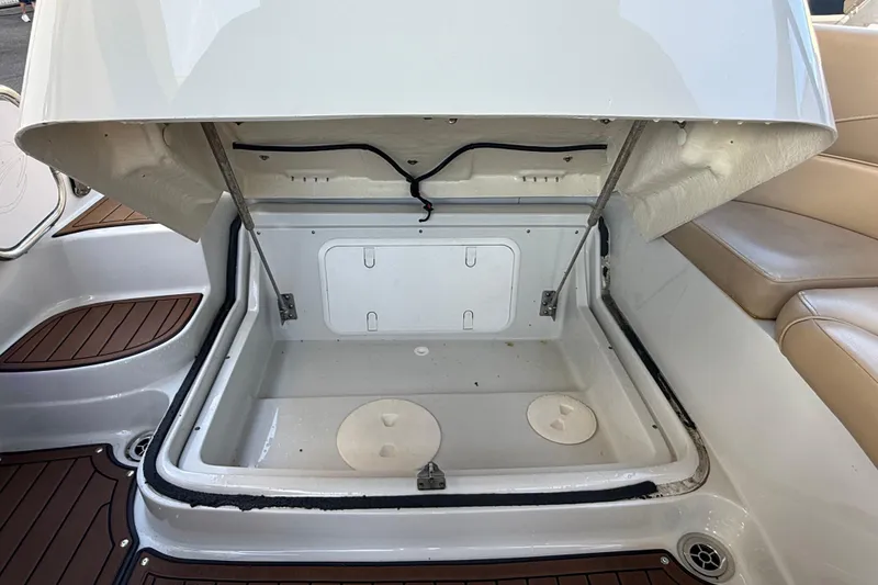 Slide: The Image of 2018 Crownline Eclipse E24 XS boat interior with speaker and cup holders. - 24