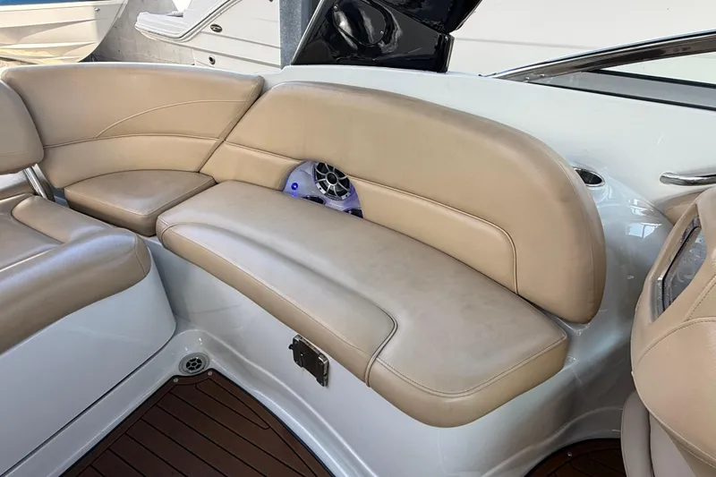 Slide: The Image of 2018 Crownline Eclipse E24 XS boat interior with cup holders and speaker system. - 25