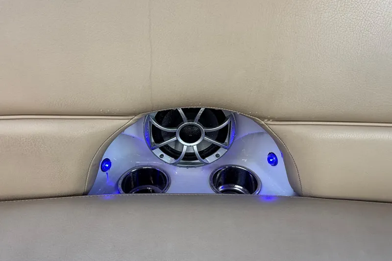 Slide: The Image of Open storage compartment on 2018 Crownline Eclipse E24 XS boat interior. - 26