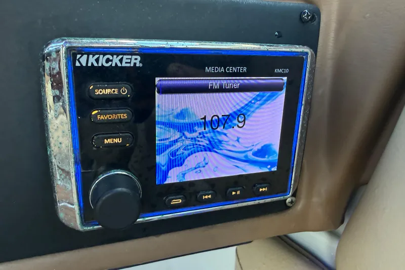 Slide: The Image of Dashboard of a 2018 Crownline Eclipse E24 XS boat with speedometer and trim gauge. - 43