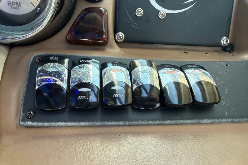 Slide: The Image of Kicker media center in 2018 Crownline Eclipse E24 XS displaying FM tuner at 107.9. - 44