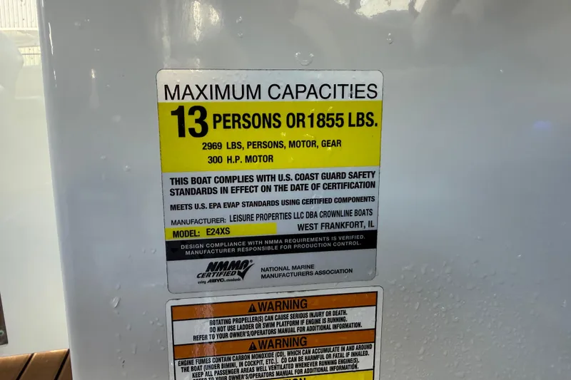 Slide: The Image of 2018 Crownline Eclipse E24 XS boat interior with brown and beige accents. - 48