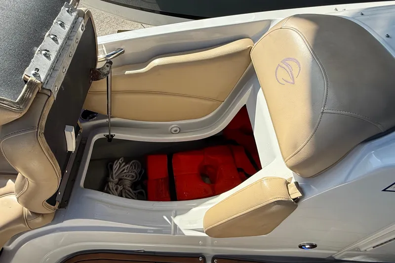 Slide: The Image of 2018 Crownline Eclipse E24 XS boat with black canopy in a marina setting. - 57