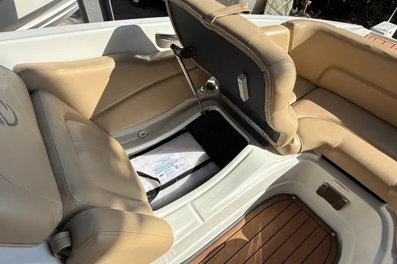 Slide: The Image of 2018 Crownline Eclipse E24 XS boat with tan leather seating and sleek design. - 59