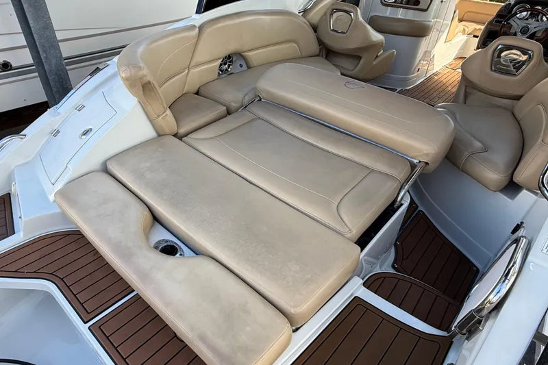 Slide: The Image of 2018 Crownline Eclipse E24 XS boat with tan leather seating and wood accents. - 62