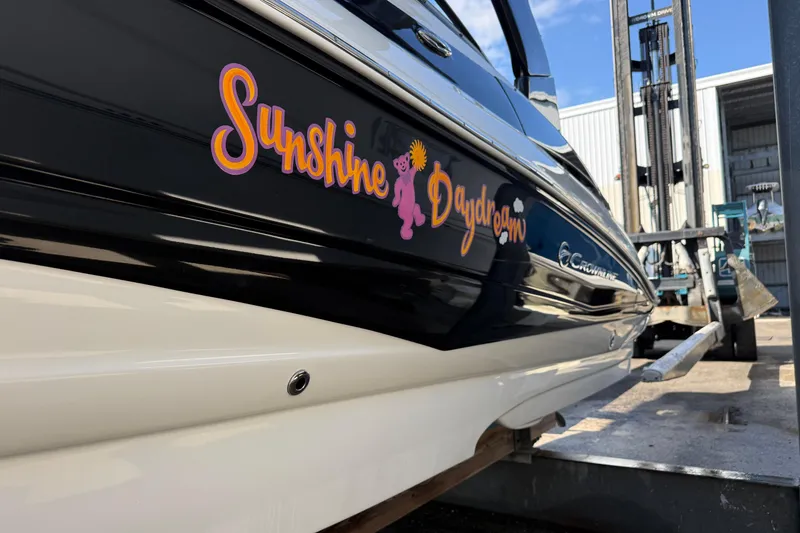 Slide: The Image of 2018 Crownline Eclipse E24 XS boat hull on wooden supports, side view. - 7