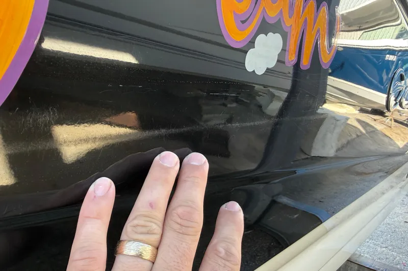 Slide: The Image of 2018 Crownline Eclipse E24 XS boat hull on wooden supports in storage facility. - 8