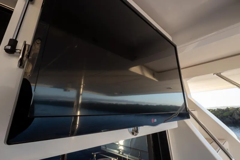 Slide: The Image of Flat-screen TV on 2015 Hampton motor yacht deck. - 11