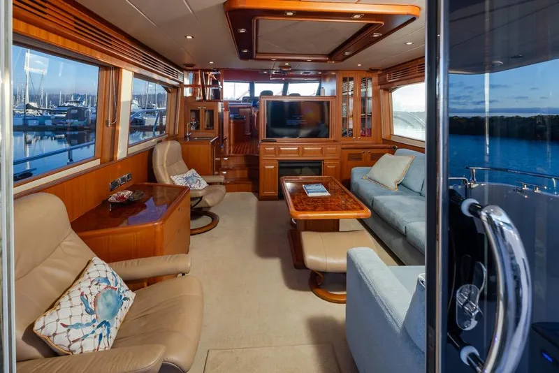 Slide: The Image of Luxurious interior of a 2015 Hampton motor yacht with elegant seating and wood finishes. - 15