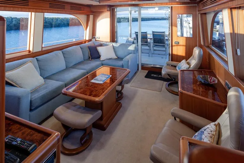 Slide: The Image of Luxurious 2015 Hampton motor yacht interior with elegant seating and panoramic windows. - 17
