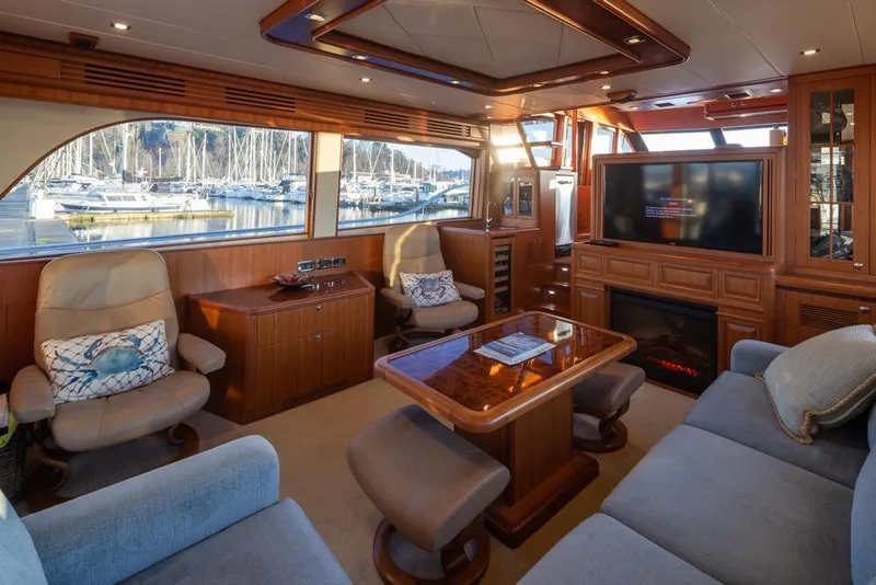 Slide: The Image of Luxurious 2015 Hampton motor yacht interior with elegant wood finishes and comfortable seating. - 18