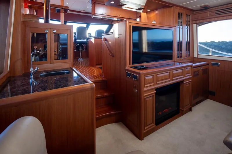 Slide: The Image of Luxurious interior of a 2015 Hampton motor yacht with wood finishes and modern amenities. - 19