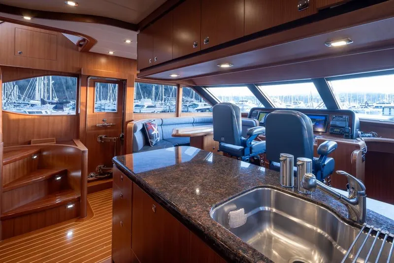 Slide: The Image of Luxurious interior of a 2015 Hampton motor yacht with modern kitchen and helm. - 22