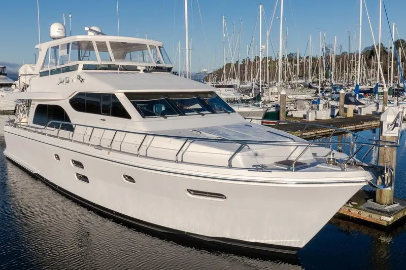 Slide: The Image of 2015 Hampton motor yacht docked at marina with clear blue sky. - 3