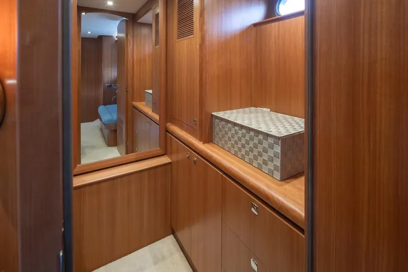 Slide: The Image of Luxurious wooden interior of 2015 Hampton motor yacht with storage and seating area. - 41
