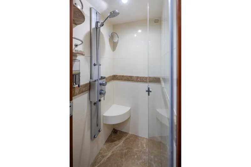 Slide: The Image of Luxurious shower in 2015 Hampton motor yacht with modern fixtures and glass door. - 44