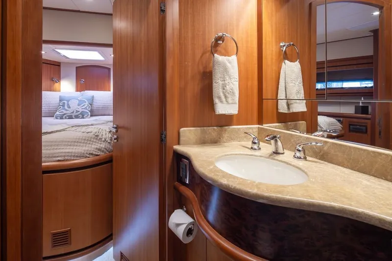 Slide: The Image of Luxurious 2015 Hampton motor yacht interior with elegant wood finishes and modern amenities. - 52