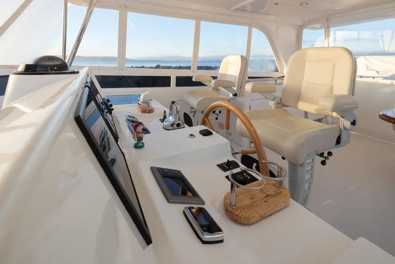 Slide: The Image of Luxurious 2015 Hampton motor yacht helm with modern controls and panoramic views. - 59