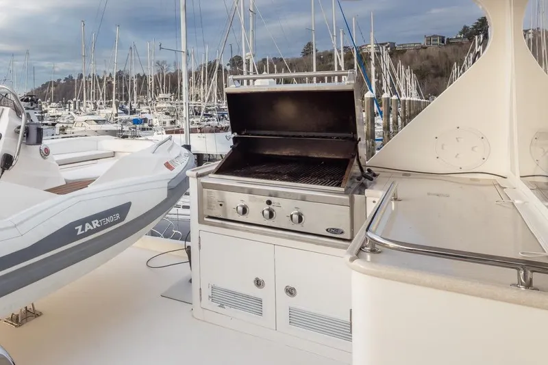 Slide: The Image of Outdoor grill on 2015 Hampton motor yacht with marina view. - 67