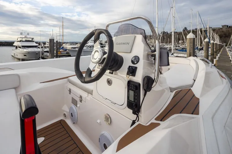 Slide: The Image of Helm of 2015 Hampton motor yacht with Garmin navigation, docked at marina. - 70