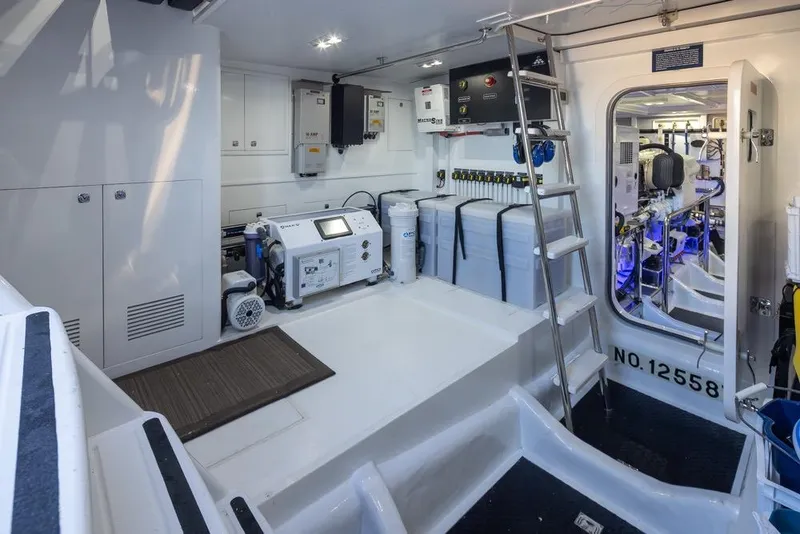 Slide: The Image of Engine room of a 2015 Hampton motor yacht, featuring modern equipment and storage. - 71