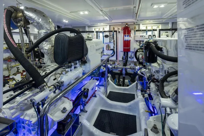 Slide: The Image of Engine room of a 2015 Hampton motor yacht, featuring advanced machinery and equipment. - 72