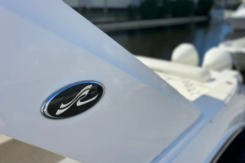 Slide: The Image of 2019 Sea Ray SLX 310 Outboard engine with blue underwater lighting. - 12