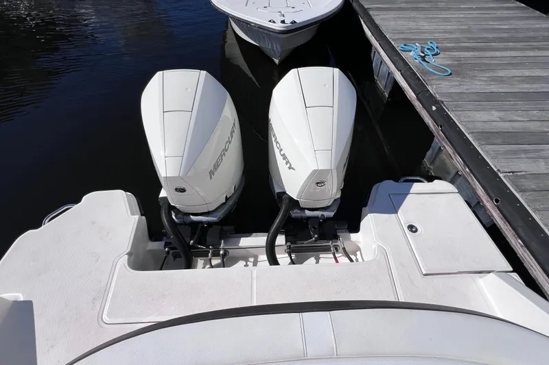 Slide: The Image of 2019 Sea Ray SLX 310 Outboard luxury boat interior at marina dock. - 16