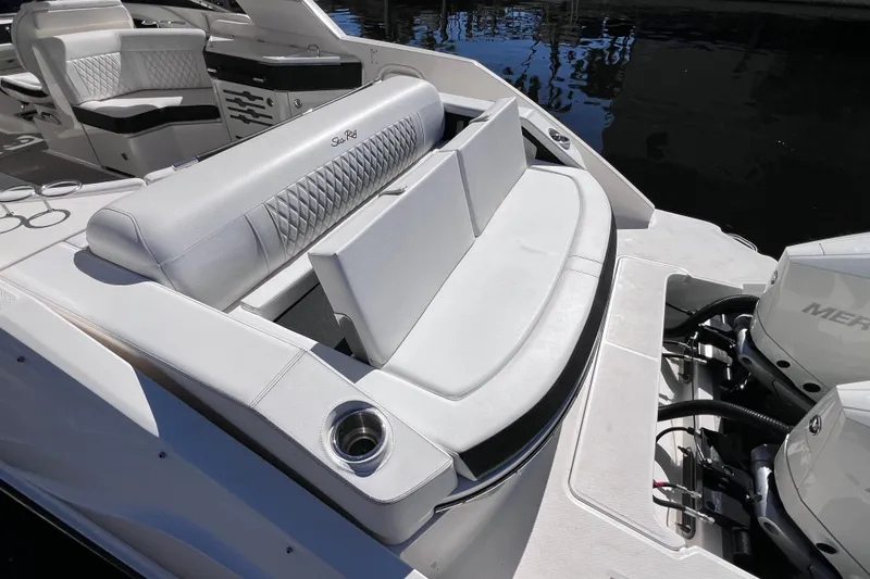 Slide: The Image of 2019 Sea Ray SLX 310 Outboard with twin Mercury engines at dock. - 17