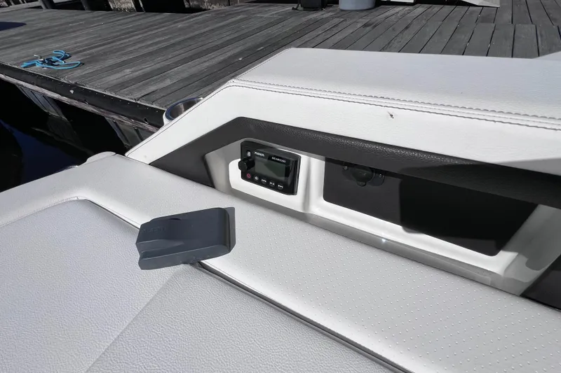 Slide: The Image of 2019 Sea Ray SLX 310 Outboard boat with luxurious seating and modern design. - 18