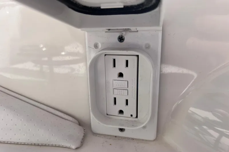 Slide: The Image of 2019 Sea Ray SLX 310 Outboard boat with open mini-fridge and grill station. - 26