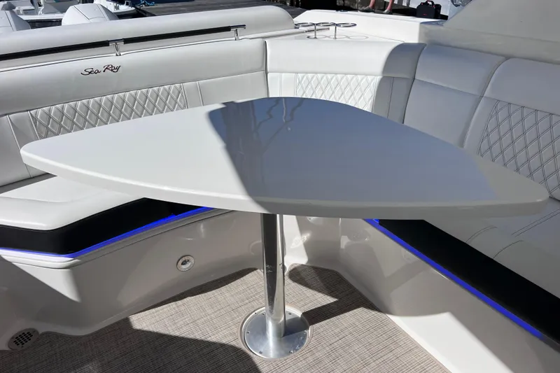 Slide: The Image of Luxurious seating on 2019 Sea Ray SLX 310 Outboard boat, docked at marina. - 28