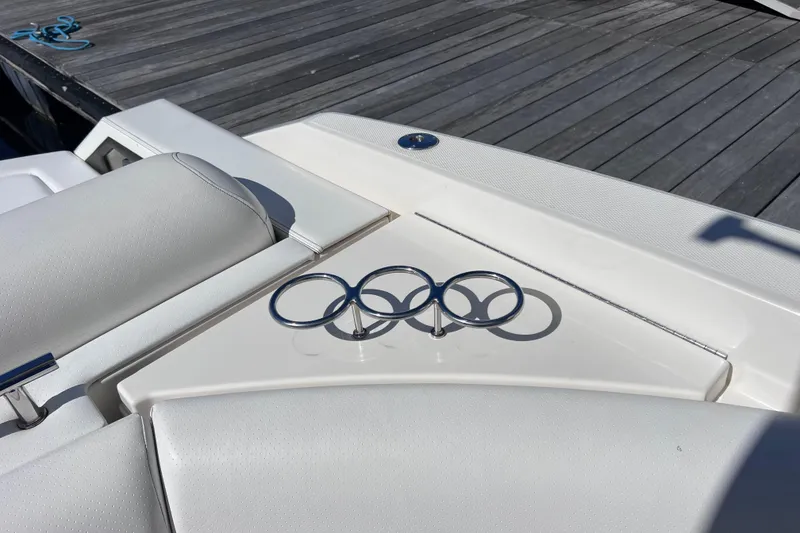 Slide: The Image of 2019 Sea Ray SLX 310 Outboard interior with sleek seating and modern table design. - 29