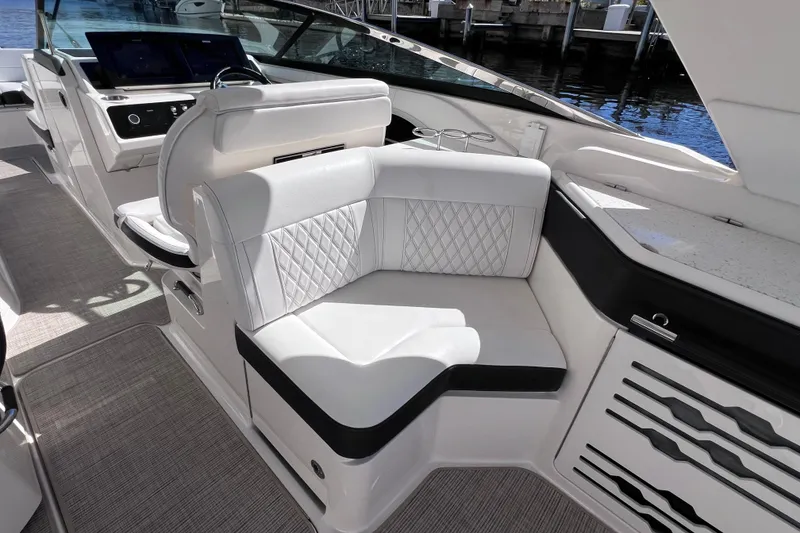 Slide: The Image of Luxurious interior of 2019 Sea Ray SLX 310 Outboard with plush seating and modern design. - 34