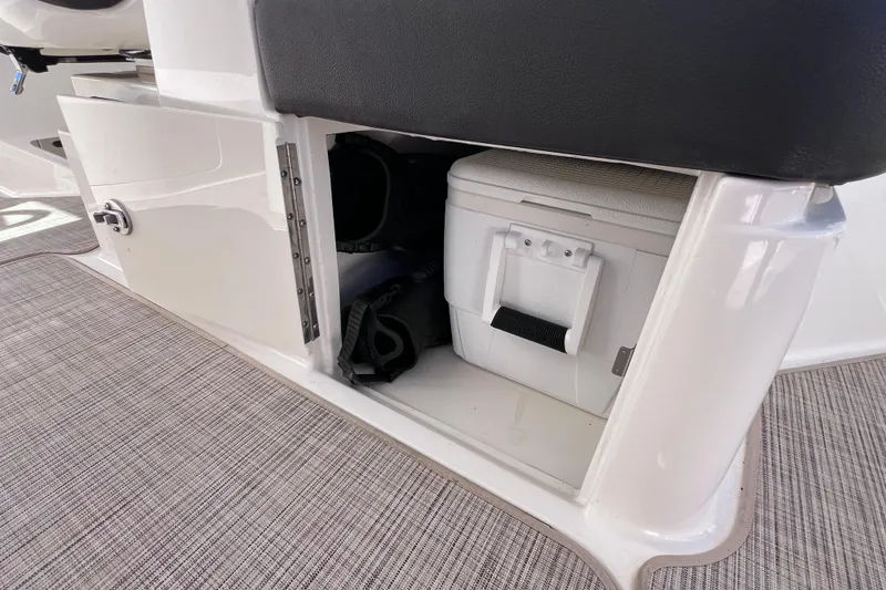 Slide: The Image of Storage compartment with cooler on 2019 Sea Ray SLX 310 Outboard boat. - 35