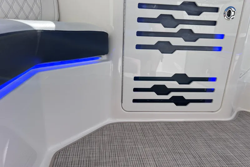 Slide: The Image of 2019 Sea Ray SLX 310 Outboard interior with blue LED lighting and modern design. - 41