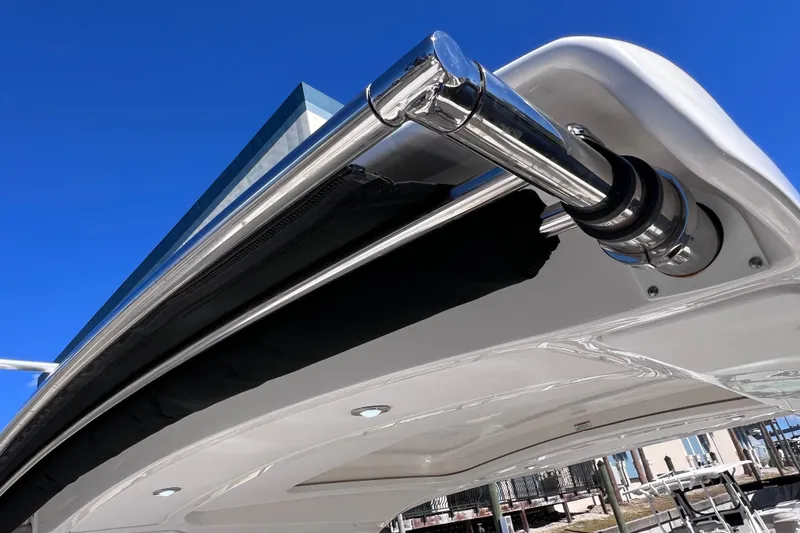 Slide: The Image of Dashboard of 2019 Sea Ray SLX 310 Outboard showing controls and battery voltage. - 47