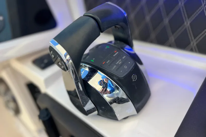 Slide: The Image of 2019 Sea Ray SLX 310 Outboard control panel with joystick and throttle. - 50