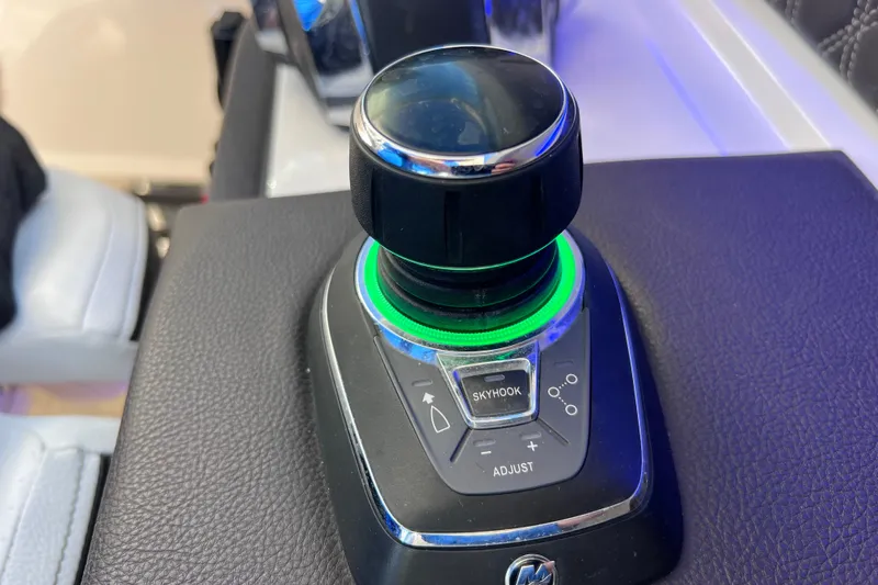 Slide: The Image of Close-up of 2019 Sea Ray SLX 310 Outboard throttle control on boat dashboard. - 51