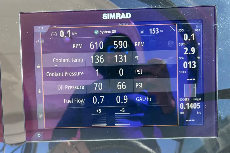 Slide: The Image of 2019 Sea Ray SLX 310 Outboard dashboard with Simrad radio and Fusion speaker. - 53