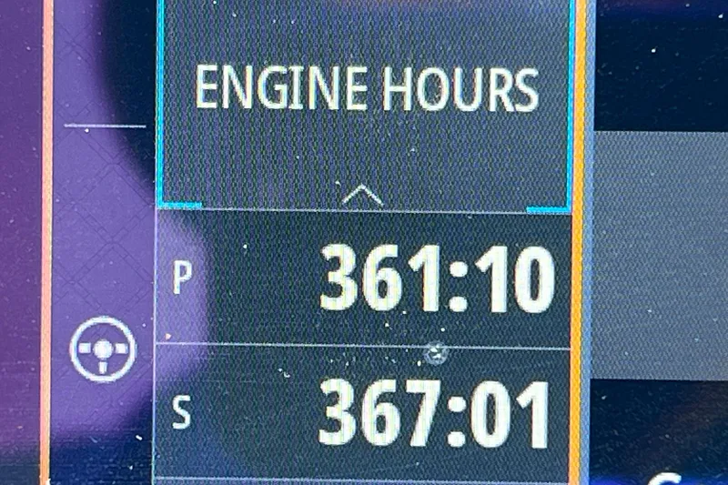 Slide: The Image of Simrad display showing 2019 Sea Ray SLX 310 Outboard engine metrics and performance data. - 54