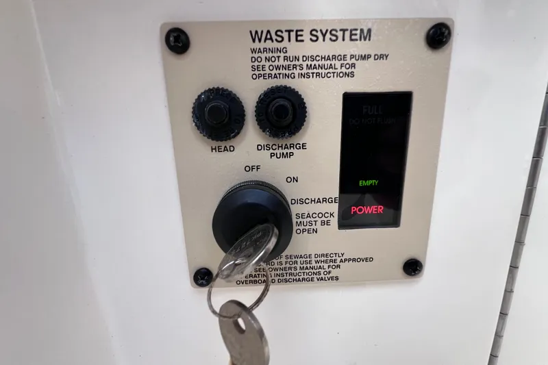 Slide: The Image of Luxurious 2019 Sea Ray SLX 310 Outboard boat bathroom with modern sink and toilet. - 57