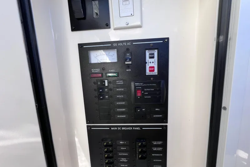 Slide: The Image of 2019 Sea Ray SLX 310 Outboard boat interior with sleek design and waterfront view. - 60