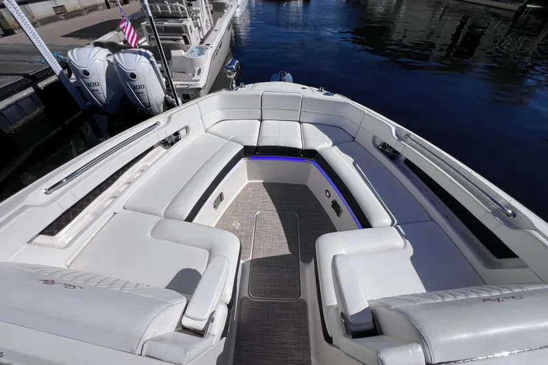 Slide: The Image of Electrical panel on a 2019 Sea Ray SLX 310 Outboard boat, featuring various switches and controls. - 61