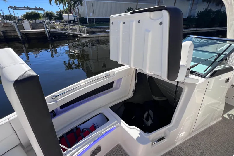 Slide: The Image of 2019 Sea Ray SLX 310 Outboard boat canopy with integrated lighting. - 73