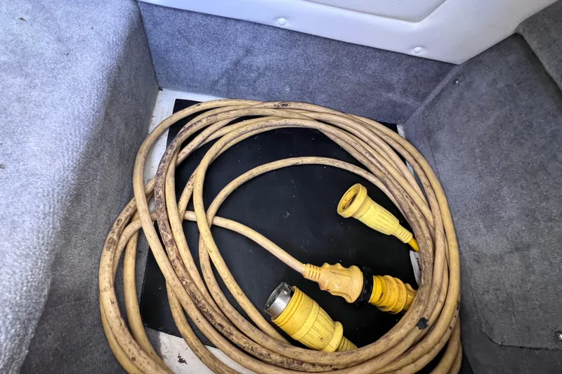 Slide: The Image of Black fabric in storage compartment of 2019 Sea Ray SLX 310 Outboard boat. - 75