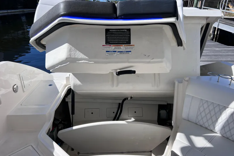 Slide: The Image of Coiled yellow power cable in 2019 Sea Ray SLX 310 Outboard boat interior. - 76