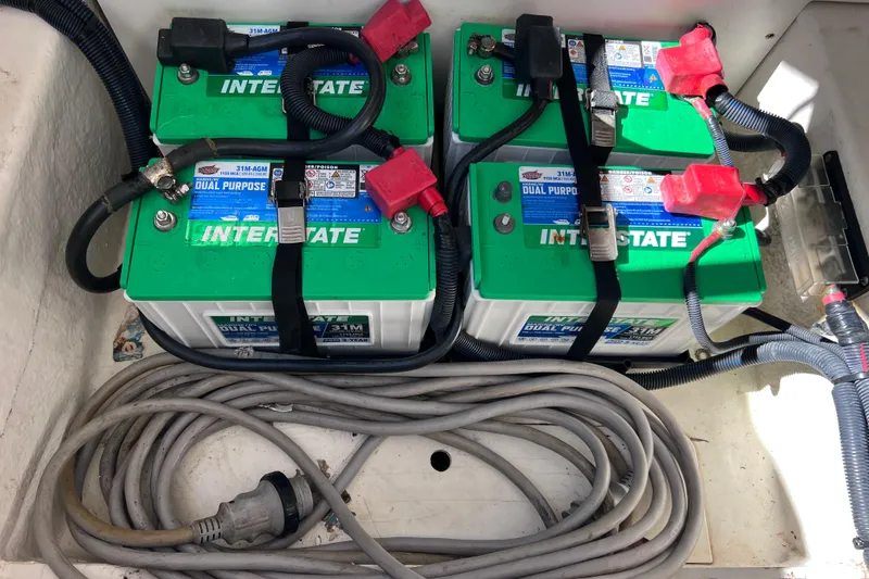 Slide: The Image of 2019 Sea Ray SLX 310 Outboard boat interior with textured flooring and removable mat. - 80