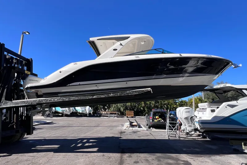 Slide: The Image of Electrical components inside a 2019 Sea Ray SLX 310 Outboard boat. - 83